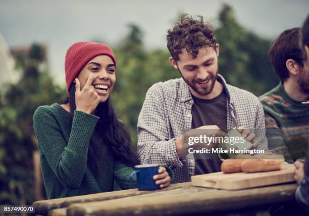 friends eating soup together in their community allotment - archive farms stock-fotos und bilder