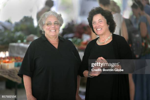 Founders of "The Food Voice" Louisa Kasdon, right, and Ilene Bezahler pose together at the Harvard University Farmers Market in Cambridge, MA on Sep....