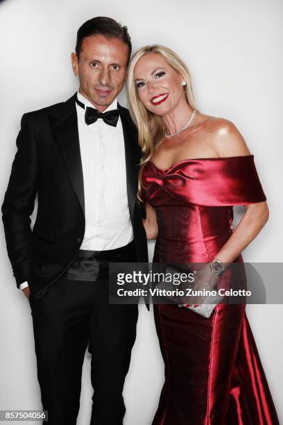 Federica Panicucci and Marco Bacini pose for a portrait during amfAR Gala Milano on September 21, 2017 in Milan, Italy.