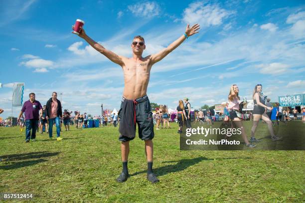 People waving flags and holding flares, and general atmosphere of the Reading Festival 2017 are pictured at Reading, on August 27, 2017. The Reading...