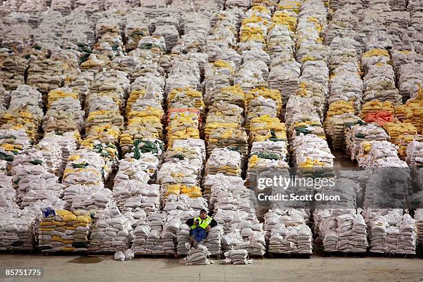 Truck driver Bryce Winjum relaxes on a pile of sandbags in the Fargodome April 1, 2009 in Fargo, North Dakota. The city of Fargo has more than...