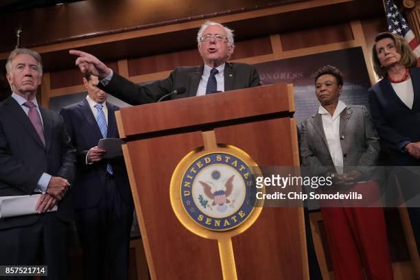 Senate Budget Committee ranking member Sen. Bernie Sanders speaks during a news conference critical of the Republican tax and budget plan with Rep....