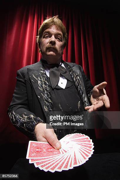 magician playing pick a card. - aufgefächert stock-fotos und bilder
