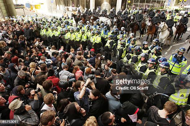 Anti-capitalist and climate change activists demonstrate in the City of London on April 1, 2009 in London, England. Protesters marched through London...