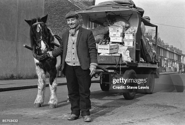 Street trader selling vegetables in Barking, in the East End of London, 1960s.