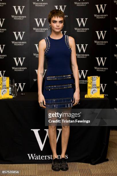 Cara Delevingne attends the signing of her debut Young Adult novel 'Mirror, Mirror' at Waterstones Piccadilly on October 4, 2017 in London, England.