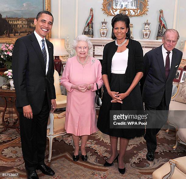 President Barack Obama and his wife Michelle Obama pose for photographs with Queen Elizabeth II and Prince Philip, Duke of Edinburgh during an...