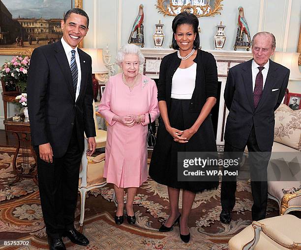 President Barack Obama and his wife Michelle Obama pose for photographs with Queen Elizabeth II and Prince Philip, Duke of Edinburgh during an...