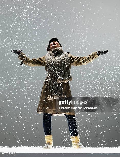 girl in the falling snow - catching snow stock pictures, royalty-free photos & images