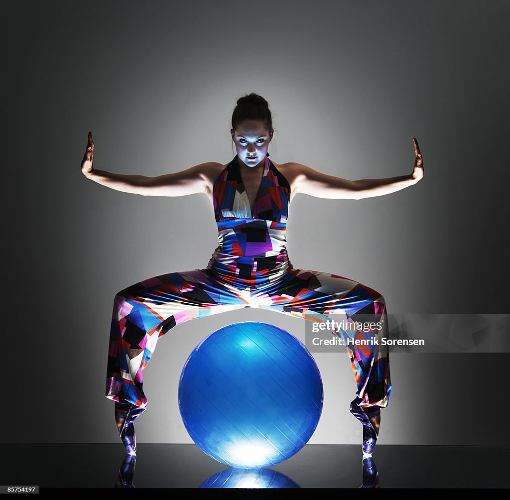 Female Dancer with a big blue ball.
