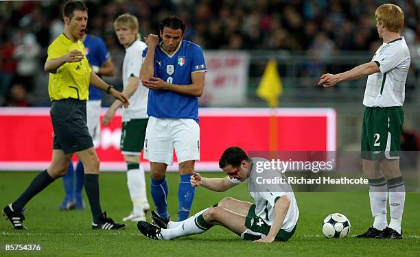 Giampaolo Pazzini of Italy elbows John O'Shea of Ireland in the head and is sent off by referee Wolfgang Stark during the FIFA 2010 World Cup...