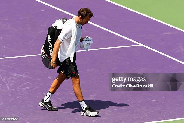 Ross Hutchins of Great Britain walks off the court after being defeated by Julian Knowle and Jurgen Melzer of Austria during day ten of the Sony...