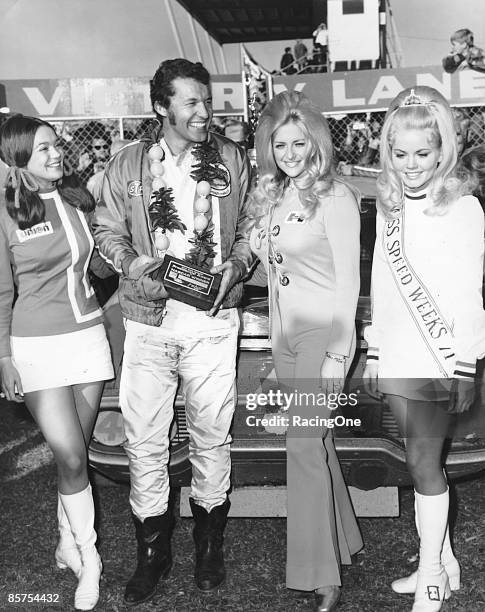 Daytona 500 winner Richard Petty in victory lane with his presidential award, presented by Miss Hurst Golden Shifter Linda Vaughn , Miss Speed Weeks...