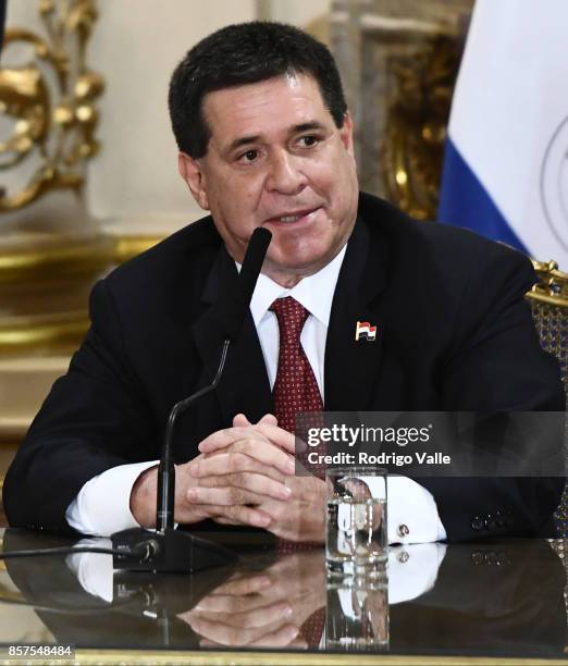 Horacio Cartes president of Paraguay talks during a press conference at Casa Rosada as part of the official visit of President of FIFA Gianni...