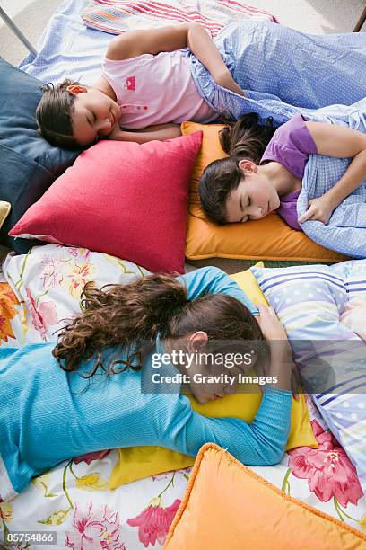 girls sleeping on floor at slumber party - slumber party stock pictures, royalty-free photos & images