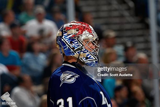 Goaltender Karri Ramo of the Tampa Bay Lightning defends the goal against the Atlanta Thrashers at the St. Pete Times Forum on March 21, 2009 in...