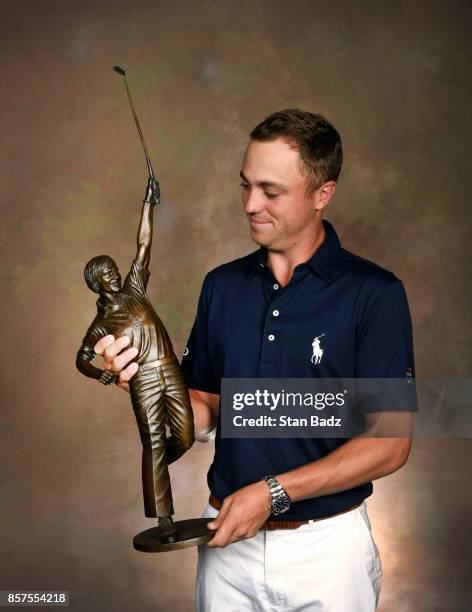 Justin Thomas holds the Jack Nicklaus award for Player of the Year during the Player of the Year ceremony at The Bear's Club on October 4, 2017 in...