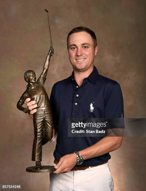 Justin Thomas holds the Jack Nicklaus award for Player of the Year during the Player of the Year ceremony at The Bear's Club on October 4, 2017 in...