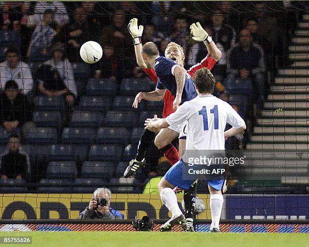 Scotland's Steven Fletcher heads the ball to score against Iceland's goalkeeper Gunnleifur Gunnleifsson during the FIFA World Cup 2010 European...