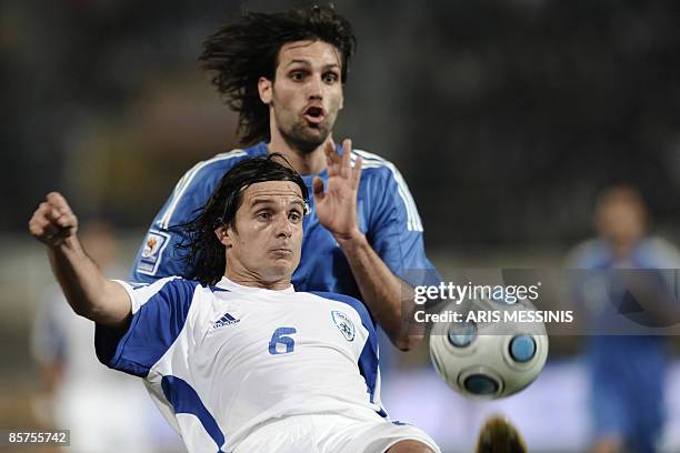 Israel's Ben Dayan fights for the ball with Greece's Georgios Samaras during their Europe group 2, qualification football game for the 2010 World Cup...