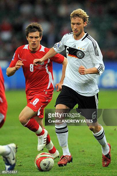 Germany's midfielder Simon Rolfes vies with Wales' midfielder Aaron Ramsey during the FIFA World Cup 2010 European Qualifying Group Four football...