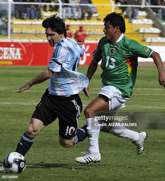 Argentina's Lionel Messi vies for the ball with Bolivia's Abdon Reyes during their FIFA World Cup South Africa-2010 qualifying match, on April 1st,...