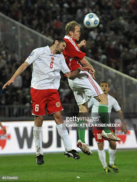 Hungary's Sandor Torghelle heads the ball with Malta's Jonathan Carvana during their World Cup 2010 qualification match at Puskas stadium of Budapest...