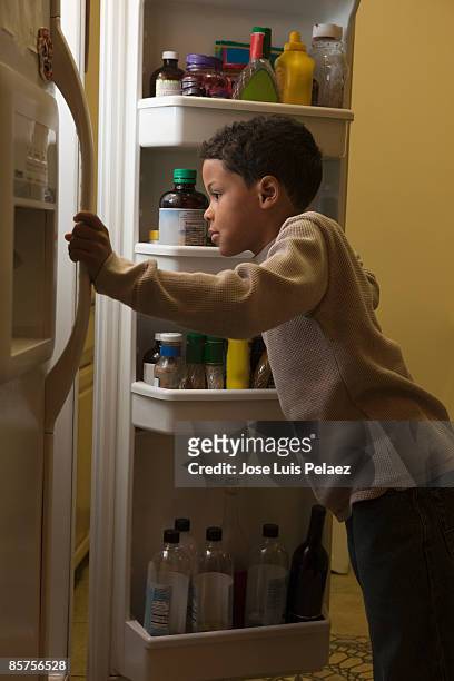 little boy looking in refrigerator - open day 6 stock pictures, royalty-free photos & images