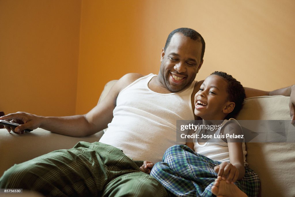 Father and son on sofa