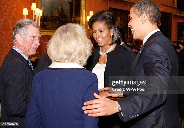 President Barack Obama and his wife Michelle speak with Prince Charles, Prince Of Wales and Camilla, Duchess of Cornwall during a reception for world...