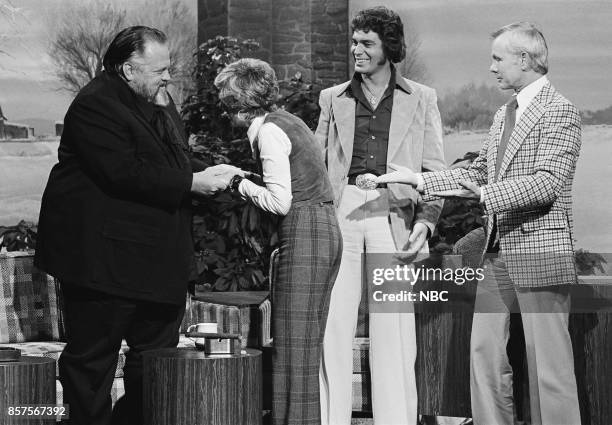 Pictured: Actor Orson Welles, journalist Kelly Lange, and singer Engelbert Humperdinck with host Johnny Carson on December 30, 1976 --