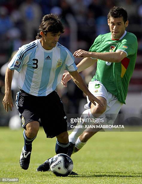 Argentina's defender Emiliano Pappa vies for the ball with Bolivia's midfielder Ronald Garcia during their FIFA World Cup South Africa-2010 qualifier...