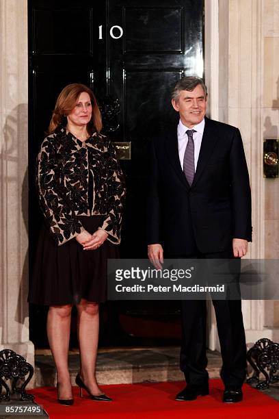 British Prime Minister Gordon Brown and his wife, Sarah Brown await the arrival of the G20 delegates at Downing Street for dinner on April 1, 2009 in...