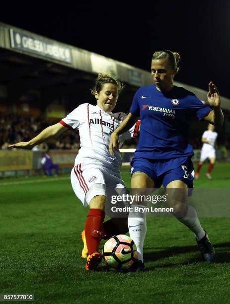 Maria Thorisdottir of Chlesea Ladies is tackled by Leonie Maier of Bayern Munich during the UEFA Womens Champions League Round of 32: First Leg match...