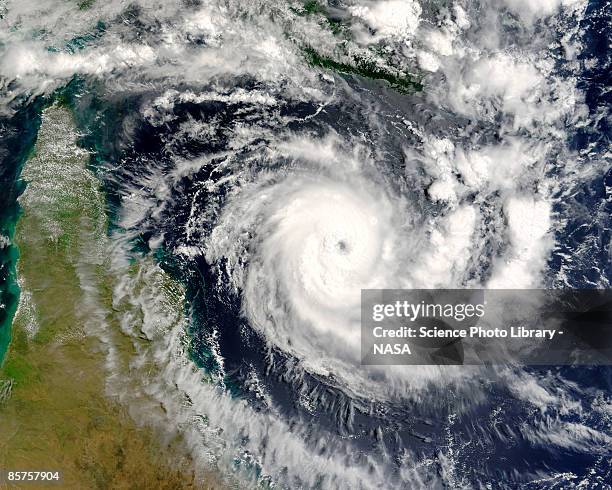 terra satellite image of tropical cyclone ingrid in coral sea - hurricane stock-fotos und bilder