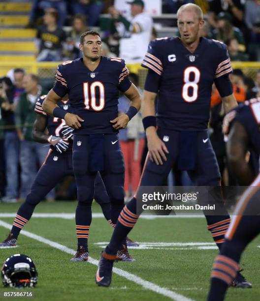 Mitchell Trubisky and Mike Glennon of the Chicago Bears participate in warm-ups before a game against the Green Bay Packers at Lambeau Field on...