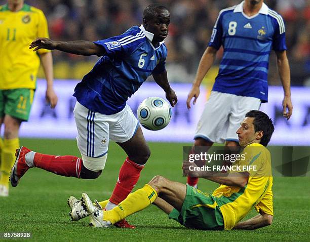 France's midfielder Lassana Diarra vies with Lithuania's midfielder Deividas Semberas during the World Cup 2010 qualifying football match France vs...