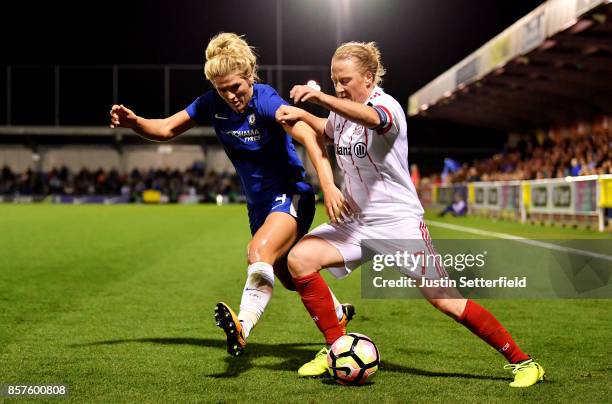 Millie Bright of Chelsea Ladies and Melanie Behringer of Bayern Munich during the UEFA Womens Champions League Round of 32: First Leg match between...