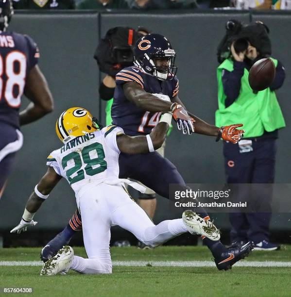 Josh Hawkins of the Green Bay Packers breaks up a pass intended for Deonte Thompson of the Chicago Bears in the end zone at Lambeau Field on...