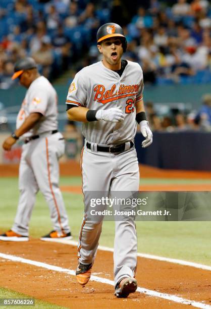 Joey Rickard of the Baltimore Orioles jogs back to the batter's box after hitting a foul ball during the game against the Tampa Bay Rays at Tropicana...