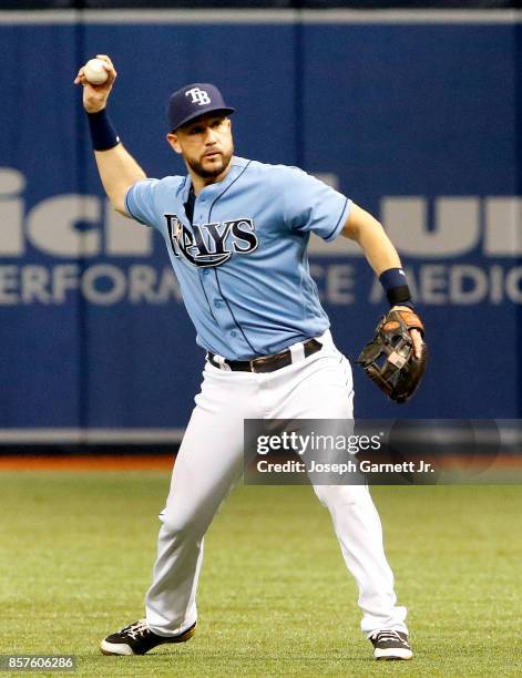 Trevor Plouffe of the Tampa Bay Rays throws the ball to first base during the game against the Baltimore Orioles at Tropicana Field on October 1,...