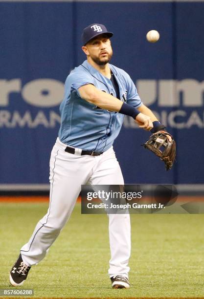 Trevor Plouffe of the Tampa Bay Rays throws the ball to first base during the game against the Baltimore Orioles at Tropicana Field on October 1,...