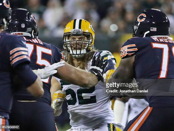 Clay Matthews of the Green Bay Packers rushes against Kyle Long and Bobby Massie of the Chicago Bears at Lambeau Field on September 28, 2017 in Green...