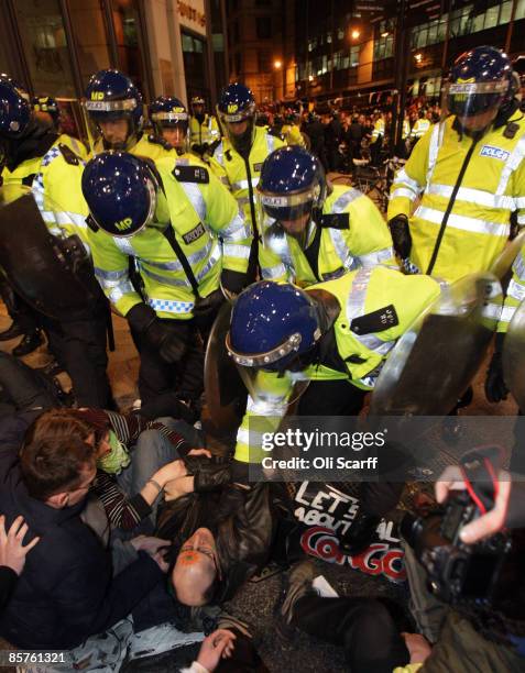 Protesters clash with police near the RBS headquarters during a demonstration by anti-capitalist and climate change groups April 1, 2009 in London,...
