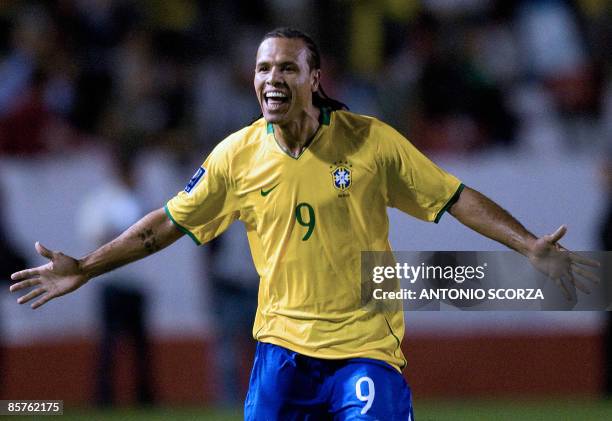 Brazil's footballer Luis Fabiano celebrates his goal against Peru during their FIFA World Cup South Africa-2010 qualifier football match at Beira Rio...