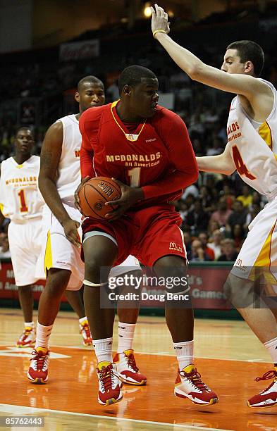 Renardo Sidney Jr. #1 of the West Team looks to shoot over Ryan Kelly of the East Team in the 2009 McDonald's All American Men's High School...