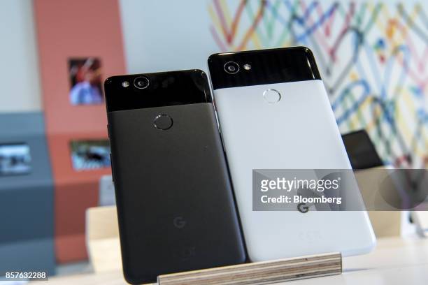 The Google Inc. Pixel 2, left, and Pixel 2 XL smartphones are displayed during a product launch event in San Francisco, California, U.S., on...