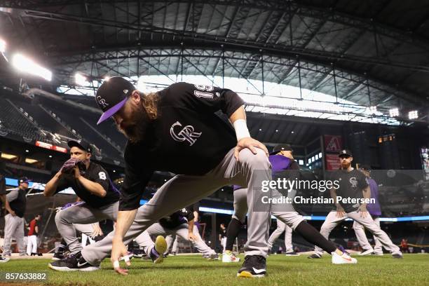 Charlie Blackmon of the Colorado Rockies stretches before the start of the National League Wild Card game against the Arizona Diamondbacks at Chase...