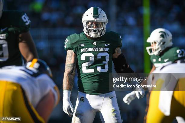 Spartans linebacker Chris Frey peers across the line of scrimmage during a Big Ten Conference NCAA football game between Michigan State and Iowa on...