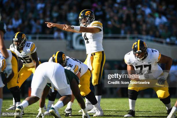 Hawkeyes quarterback Nathan Stanley points out the defensive coverage during a Big Ten Conference NCAA football game between Michigan State and Iowa...